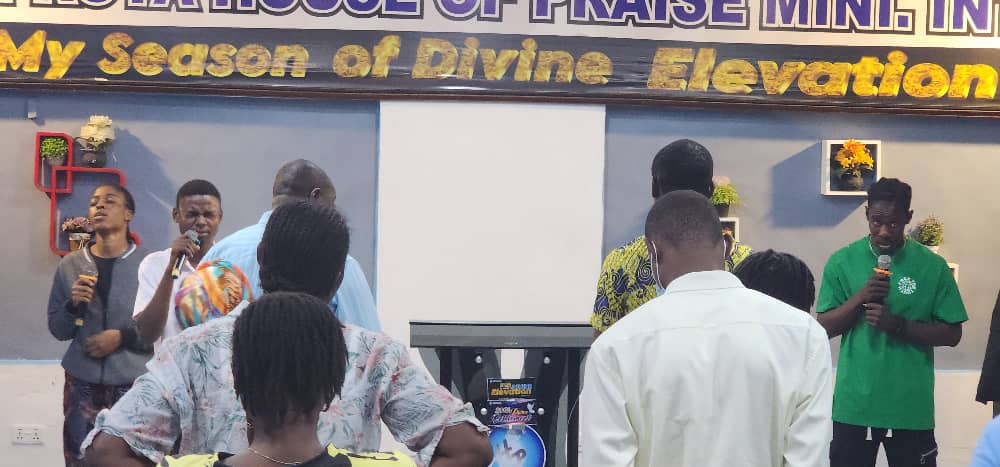 Prayer gathering with church members.